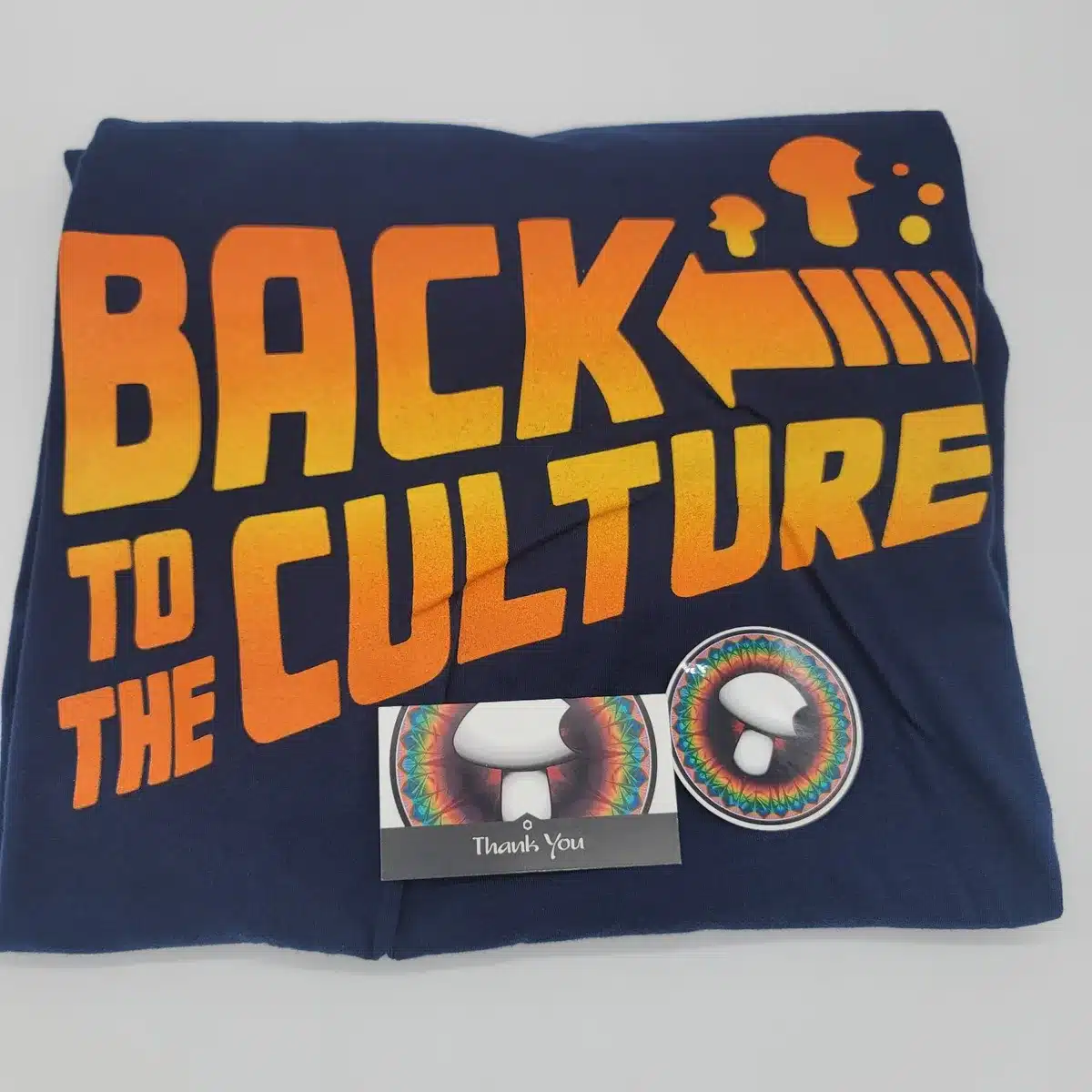 Close-up of the Back to the Culture logo on the t-shirt, highlighting soft fabric and high-quality print for mushroom enthusiasts.