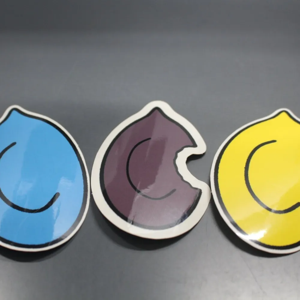 Colorful mushroom-inspired stickers with yellow, purple, and blue spores.